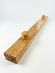 Soft Maple quilt hanger is a clamp-style hanger that won't damage your quilt, with round wooden knobs and visible wood grain on a white background.